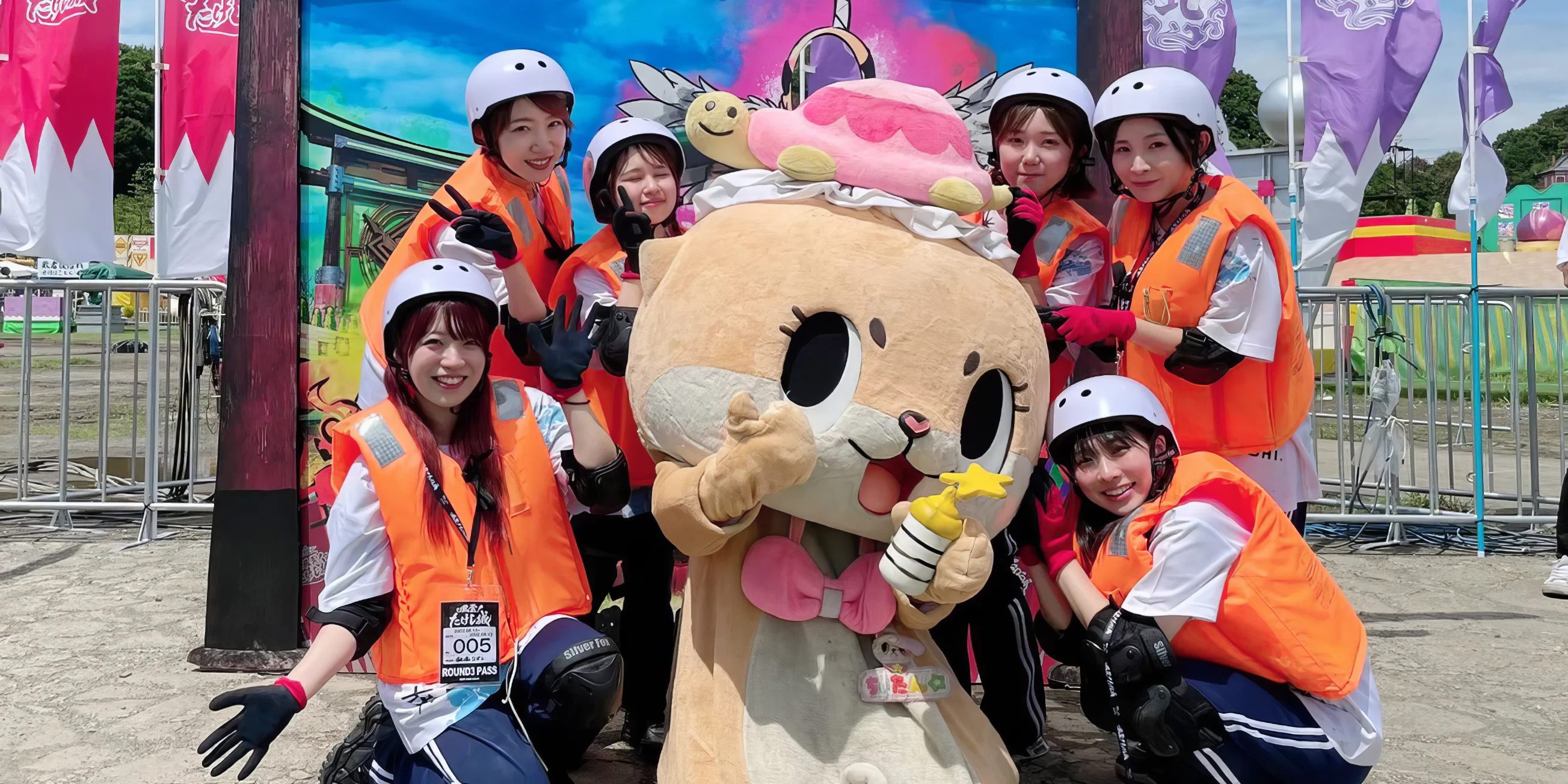 Chiitan - a hamster mascot - poses with a group of young female contestants on the set of Takeshi's Castle